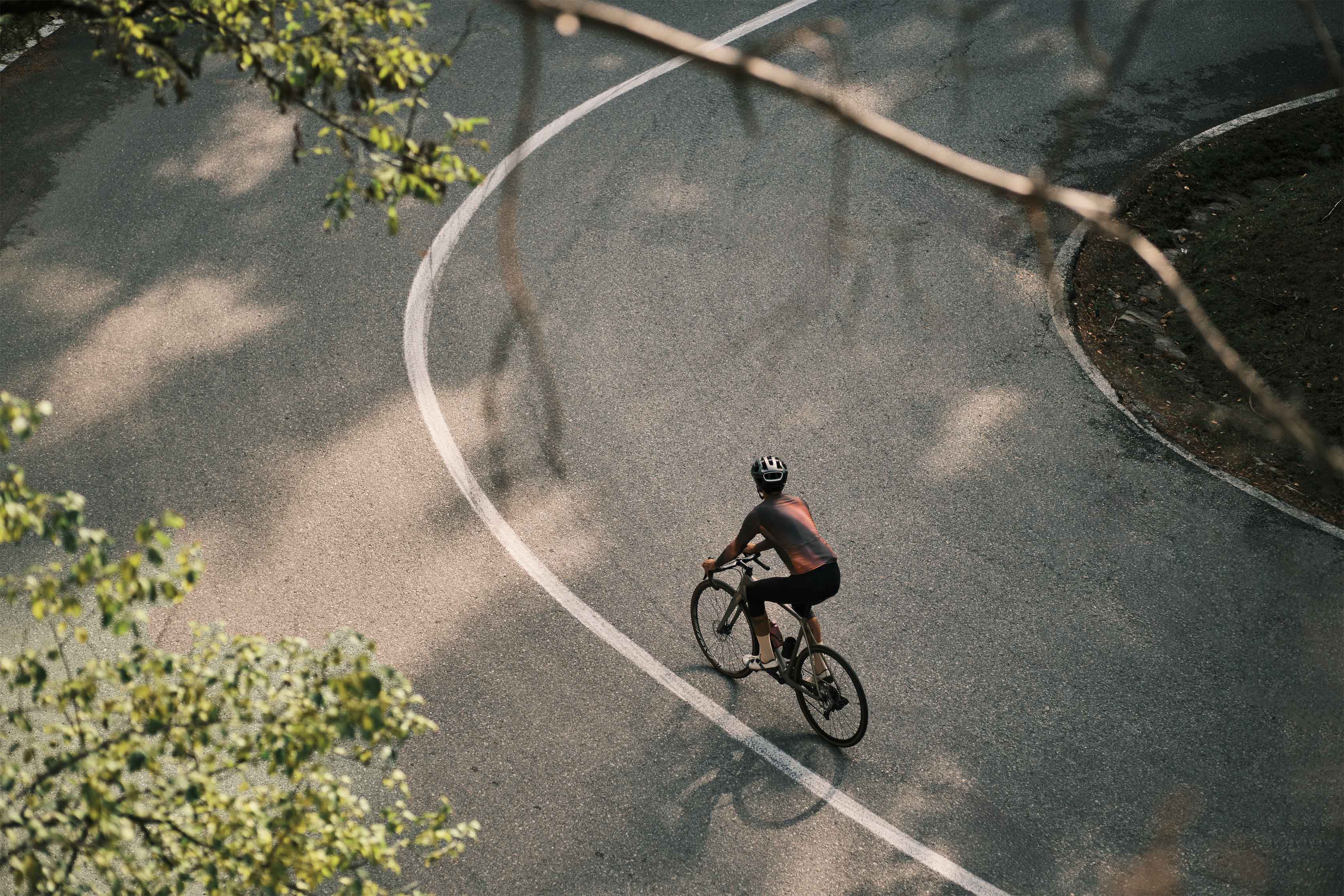 Cyclists riding through scenic hills